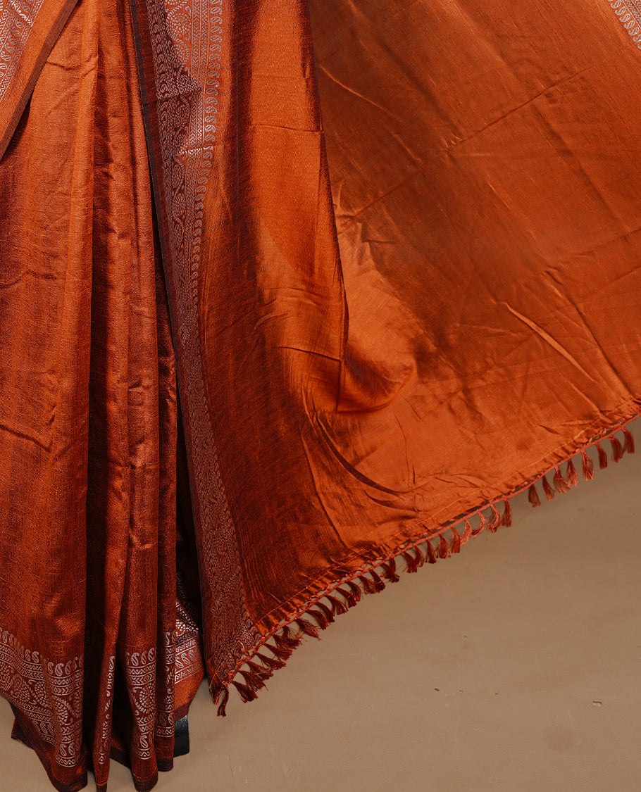Rust Orange colour semi silk saree featuring Elegant plain body with fancy border, comes with matching self colour blouse piece.