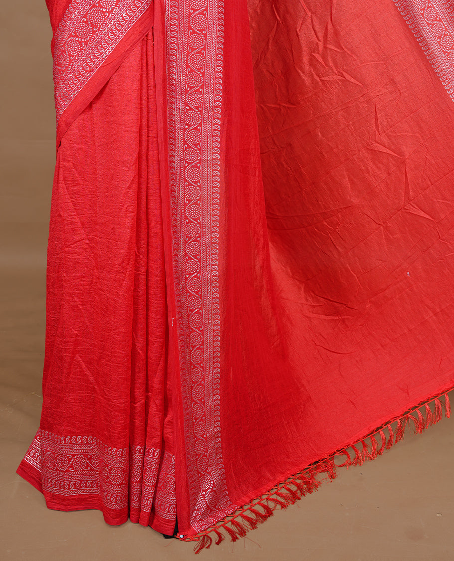 Red colour semi silk saree featuring Elegant plain body with fancy border, comes with matching self colour blouse piece.