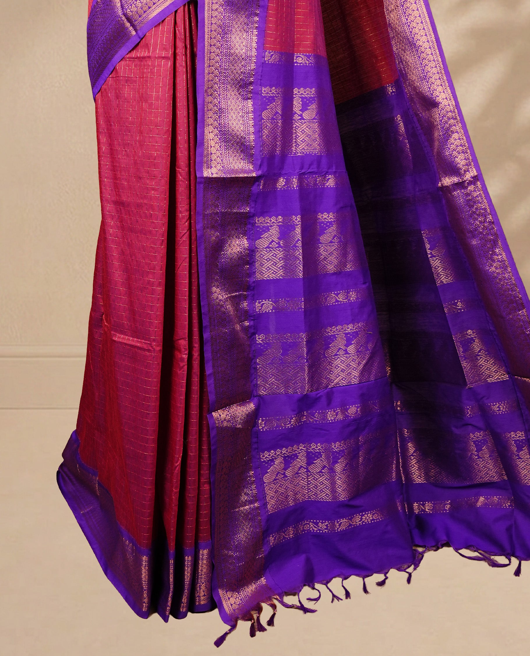 Maroon colour kalyani cotton saree featuring gold zari check pattern on body, complemented by Violet colour with Antique zari border, paired with matching blouse piece.