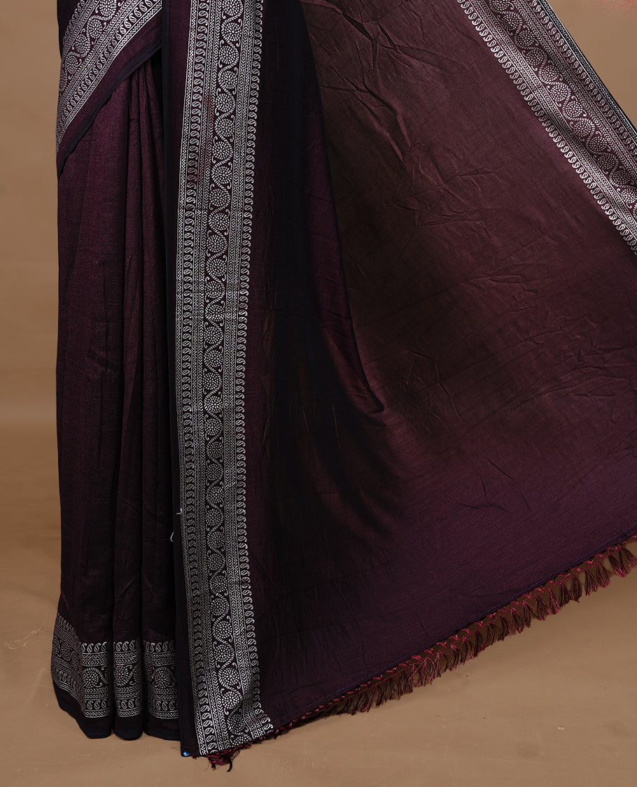 Chocolate colour semi silk saree featuring Elegant plain body with fancy border, comes with matching self colour blouse piece.