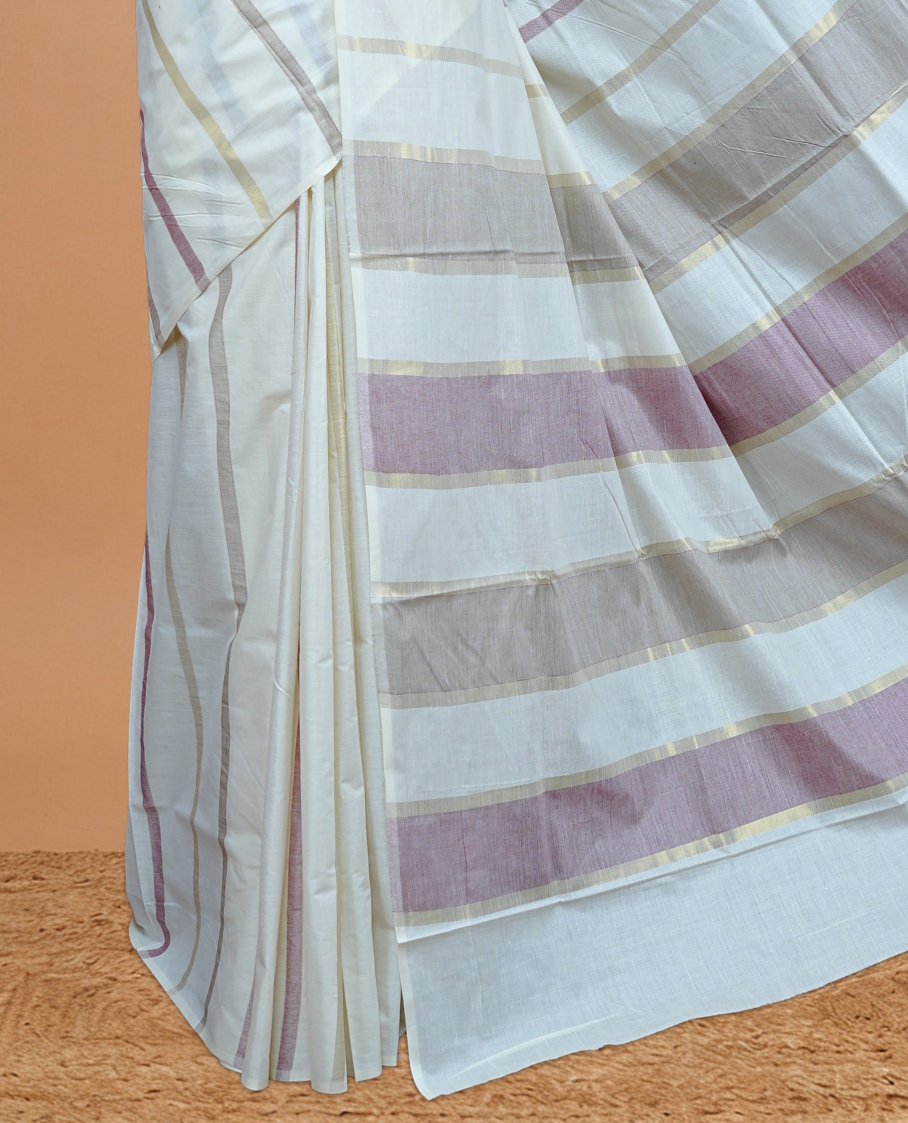 Cream Colour Cotton Kerala Saree Featuring Gray & Light Maroon On The Body & Pallu, Paired With A Matching Blouse Piece.