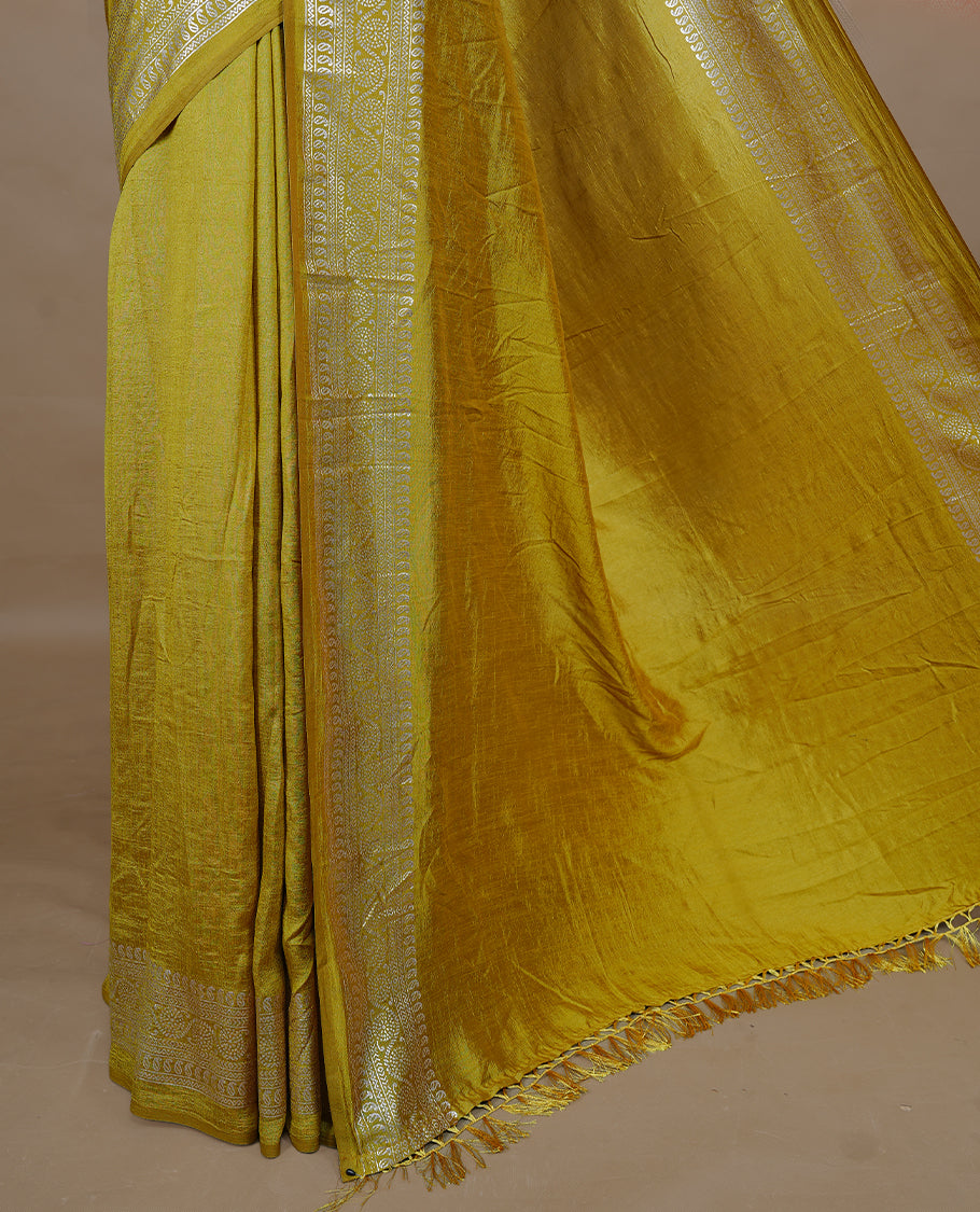 Mustard colour semi silk saree featuring Elegant plain body with fancy border, comes with matching self colour blouse piece.