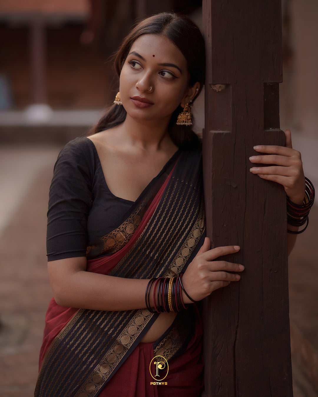Brick Red colour Chettinad cotton saree with a plain body, featuring a traditional border and pallu in Dark Brown colour, paired with a matching blouse piece
