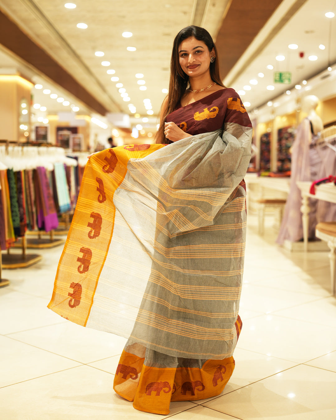 Mustard With Maroon Bengal cotton saree featuring Ganga Jamuna Style Contrast Border with elephant motifs, Striped pallu.