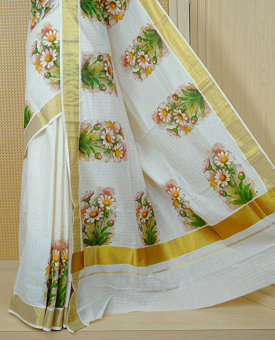 Cream Colour Kerala Saree Featuring Gold Zari Stripes On The Body, Enhanced By A Gold Zari Border With Floral Prints And A Matching Pallu, Paired With A Matching Blouse Piece.