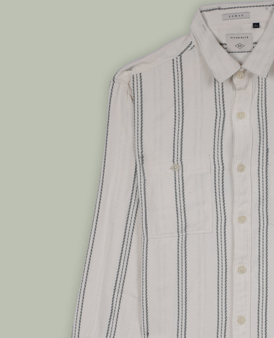 Cream colour shirt with pastel green vertical stripes, crafted in soft cotton for all day comfort, Featuring full sleeves, dual chest pockets, and a classic collar, it delivers a bold yet timeless casual style.