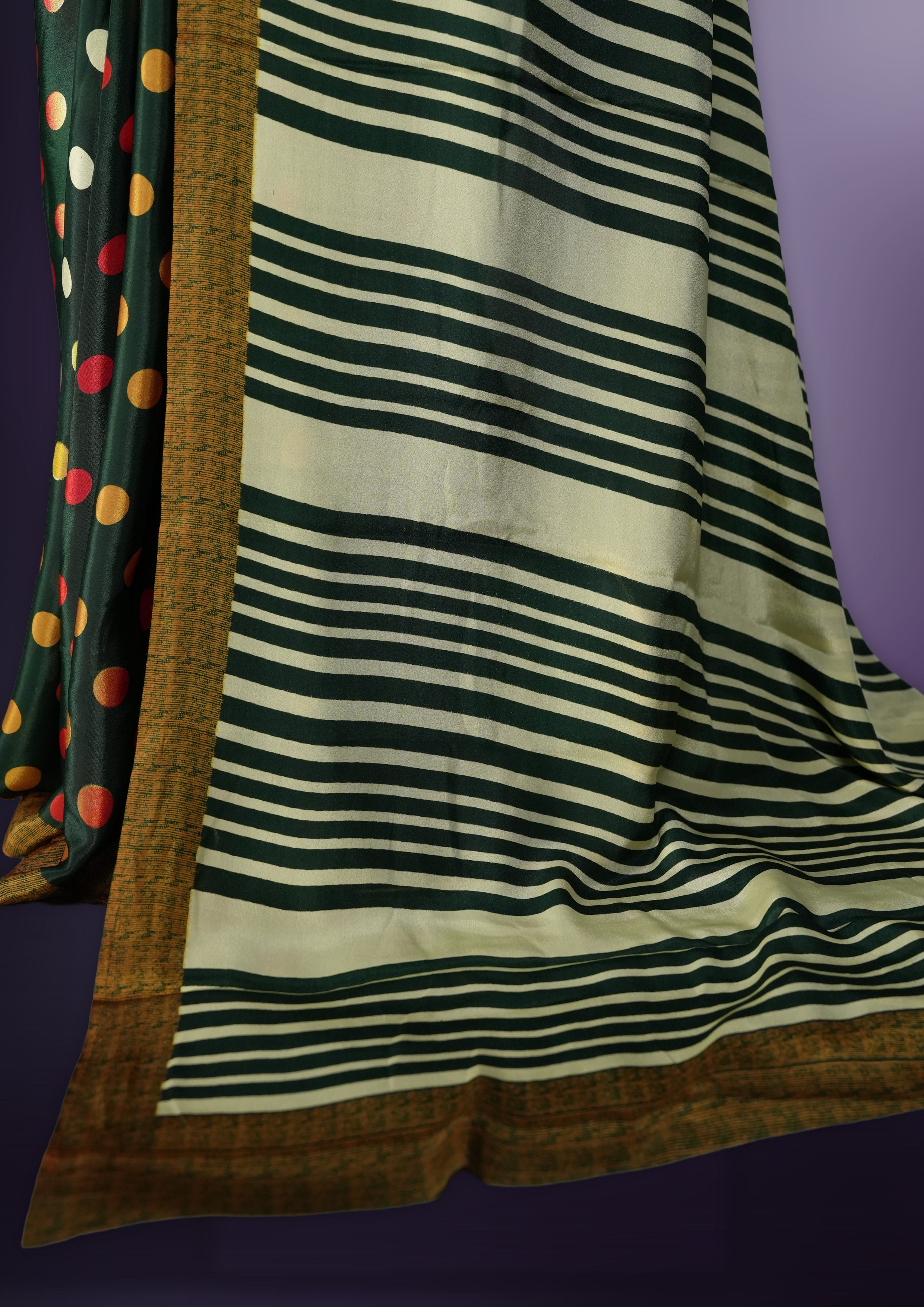Green colour saree with with large big polka dots on the body, self stripped pallu & Comes with a stylish matching blouse.