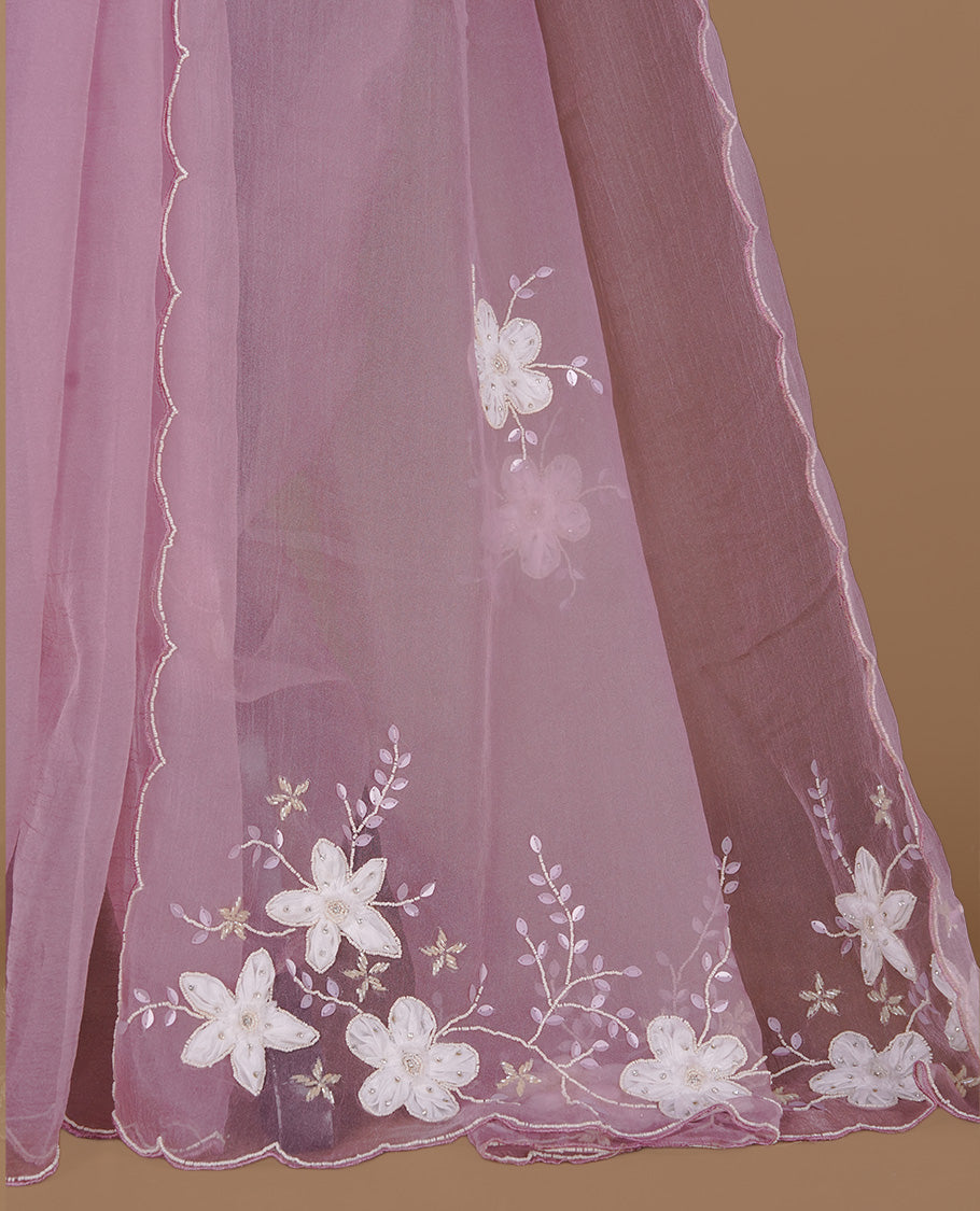Pink colour crush organza saree featuring white floral work with beats & sequins, highlighting scalp with beats worked border, paired with matching blouse piece.