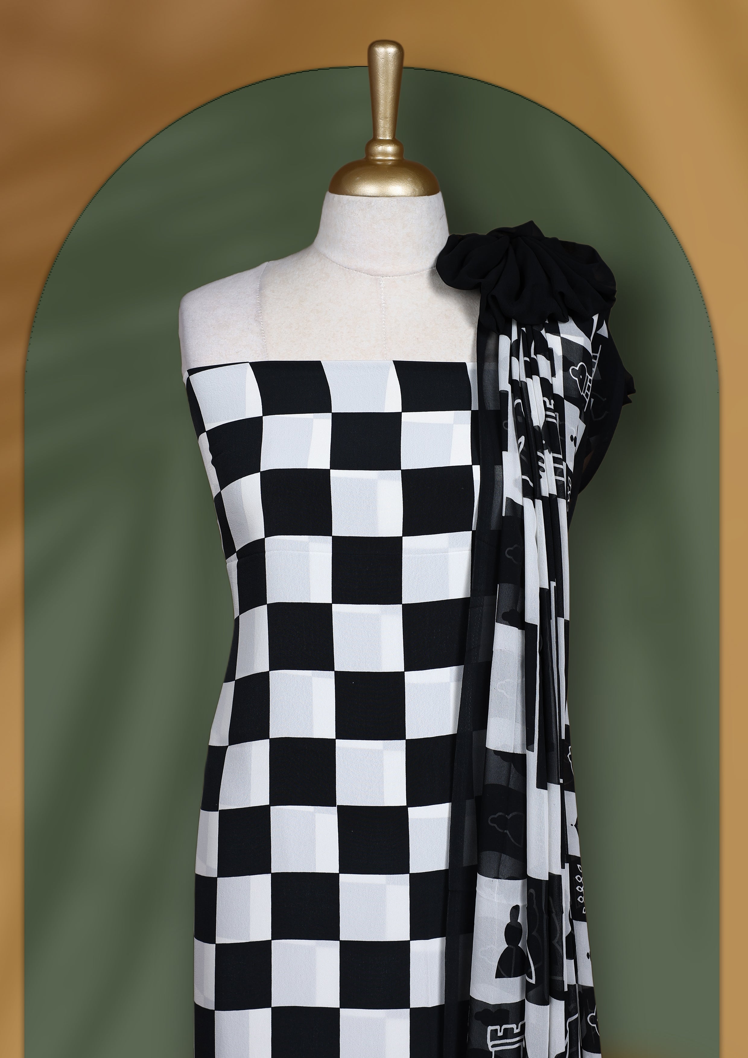 Black & white churidar set featuring a crepe top with chessboard and character prints, paired with a plain santoon bottom and a georgette dupatta adorned with chess coin prints.