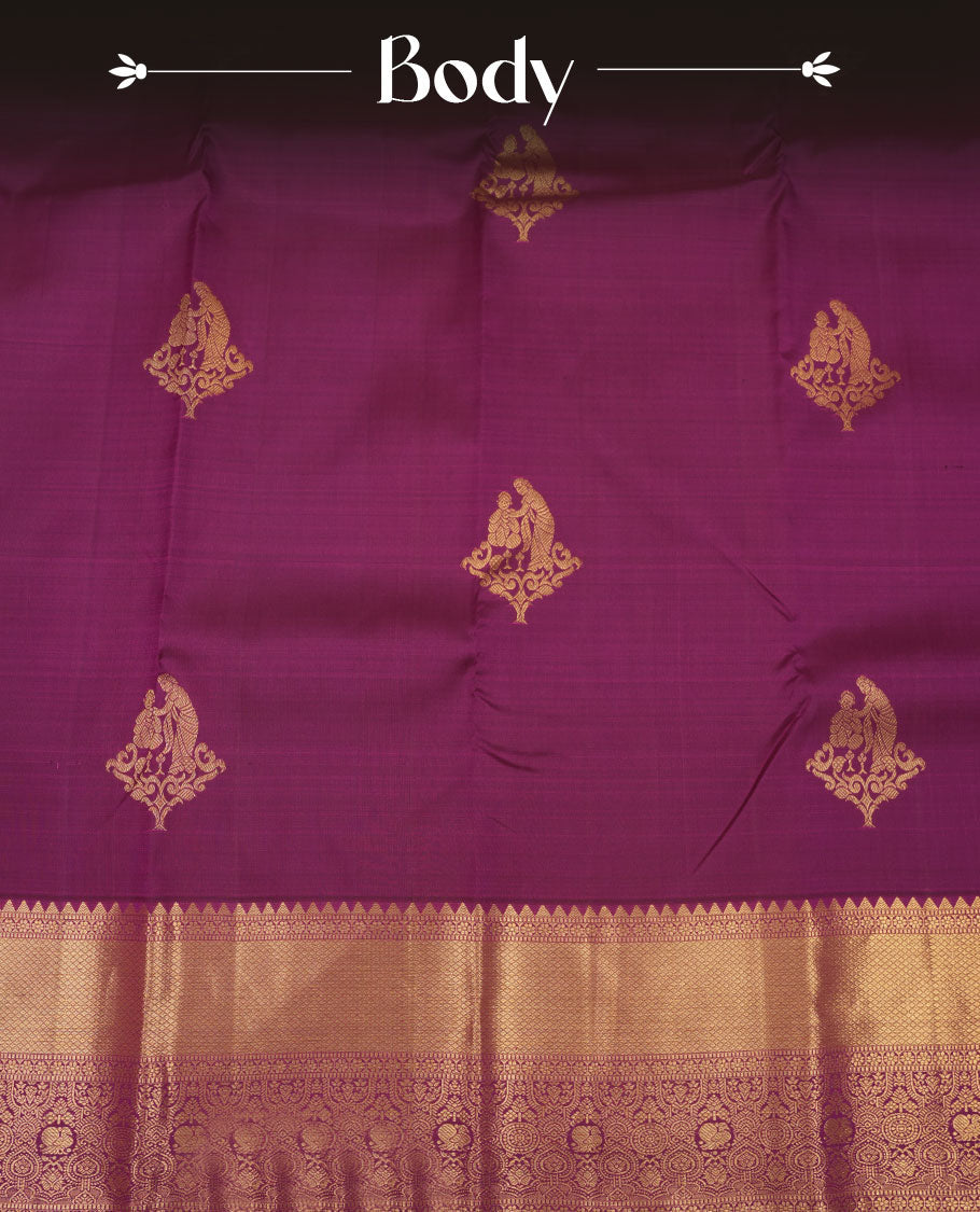 Rich magenta colour pure traditional Kancheepuram silk saree adorned with an elegant zari motif on the body, complemented by a grand gold zari woven border with intricate traditional patterns, paired with a matching blouse piece.