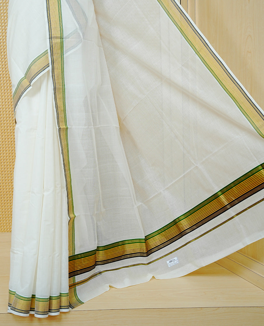 Cream colour Cotton kerala saree featuring Classy Plain body, complemented by Gold with Green & Black zari border & Pallu, paired with matching blouse piece.