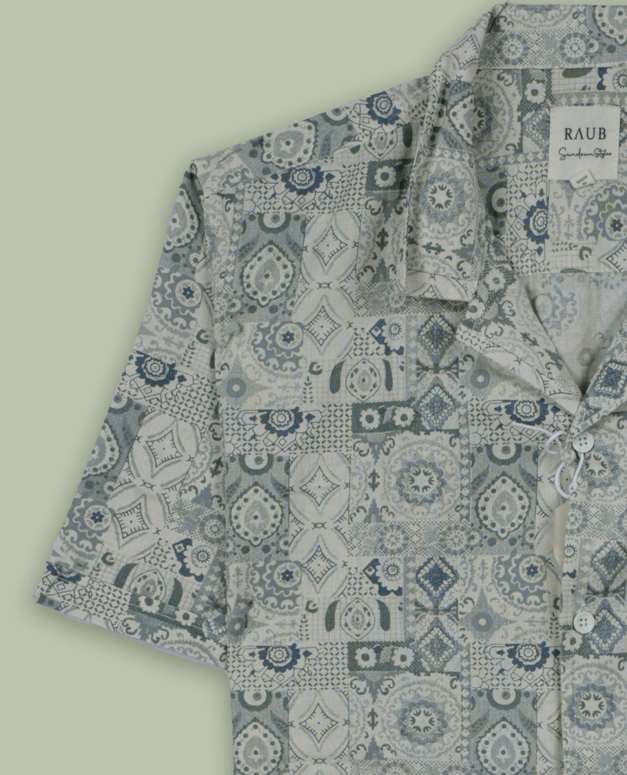 Cream colour short sleeve shirt features a rounded spread collar and a featuring an intricate blue and grey geometric tile design & its ideal for both casual days and laid back evenings.