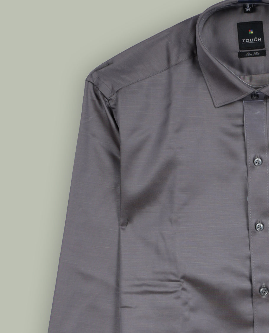 Grey colour satin shirt with a smooth, lustrous finish, Features a classic collar, full sleeves with cuffs, and a front pocket & Perfect for evening wear or special occasions with a sleek, polished look.