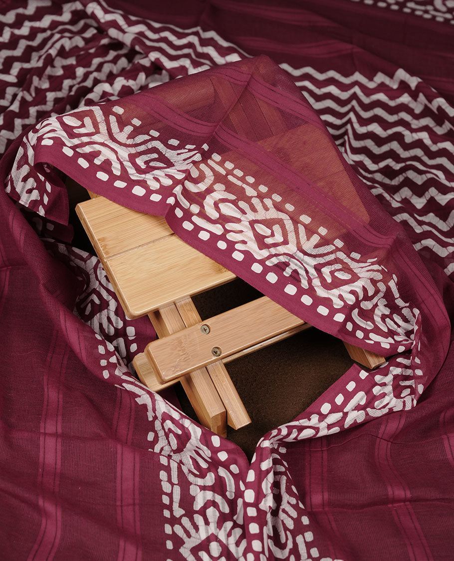 Grape wine colour churidar material featuring white floral printed body, paired with a matching chevron printed dupatta.