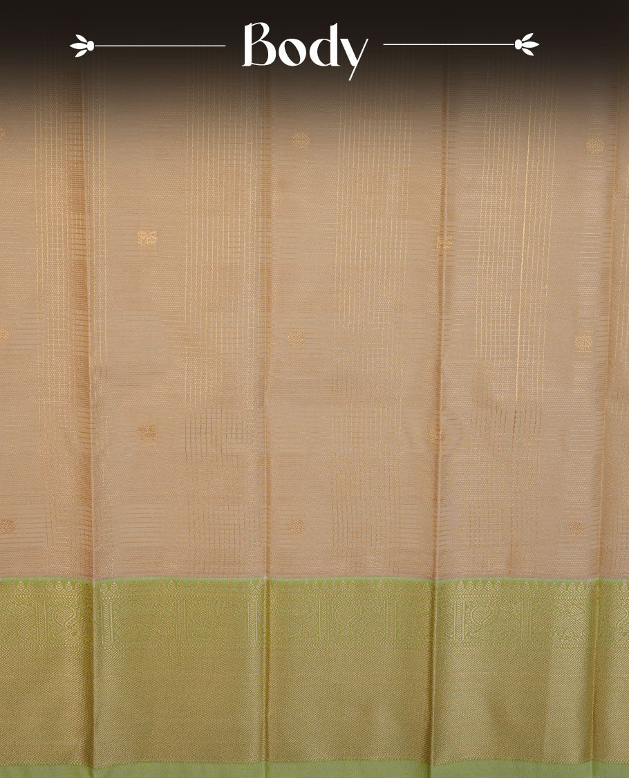 Beige colour semi silk saree highlighting gold zari check pattern and motifs across body, featuring contrast pastel green colour border with gold zari pattern, comes with matching blouse .