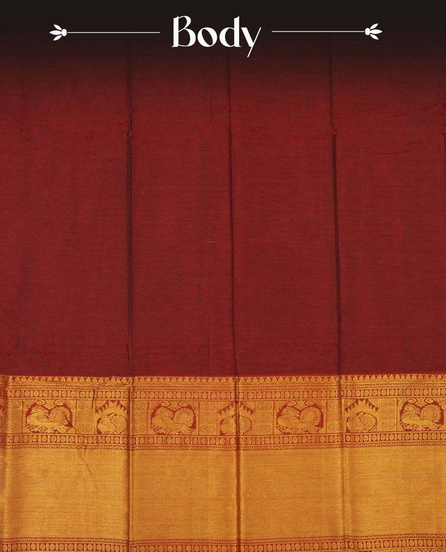 Dark red colour Narayanapattu cotton saree featuring a self coloured body, contrast Green colour with gold zari border and pallu, pairing a matching blouse piece.