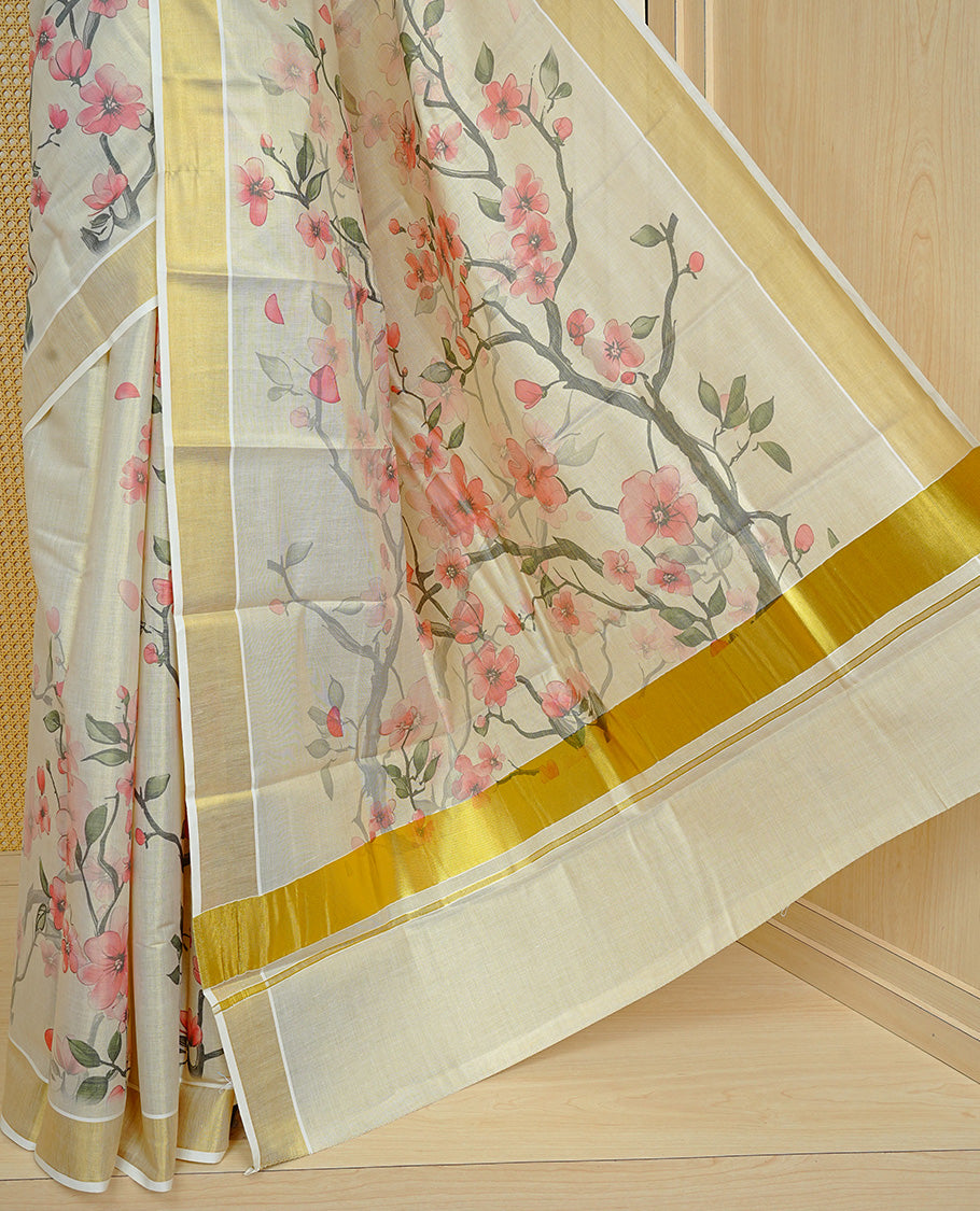 Cream colour Tissue kerala saree featuring Floral print on body, complemented by Floral Print & kasavu kara, comes with matching blouse piece.
