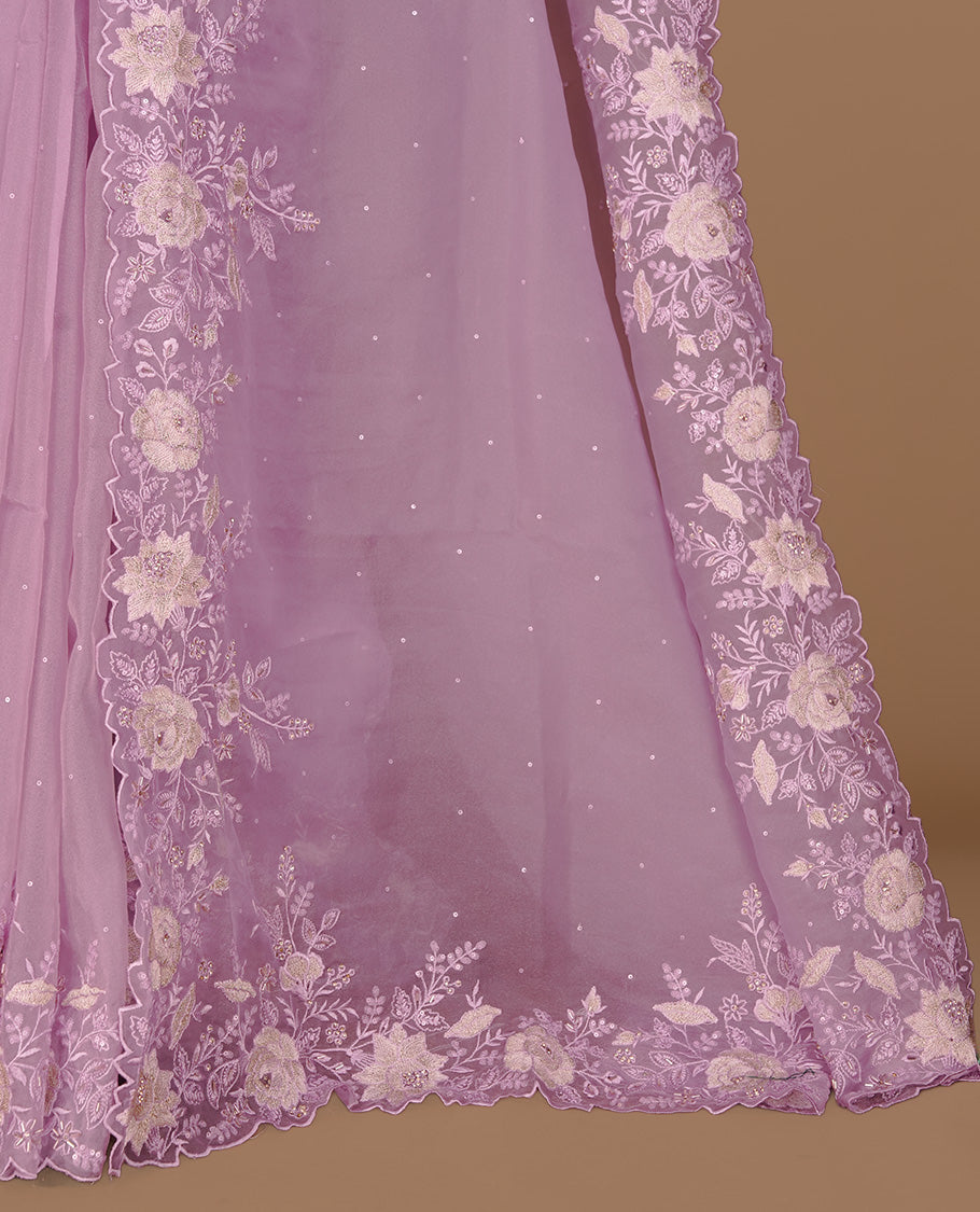 Pastel purple colour organza saree featuring thread with cut beats & sequins floral pattern on body, highlighting scalp border, paired with matching blouse piece.