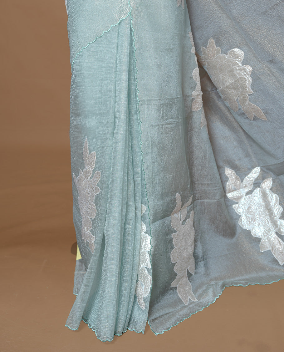 Pastel Green colour Crush Organza Saree featuring White floral Pattern on body, complemented by classy Thread border, paired with matching blouse piece.
