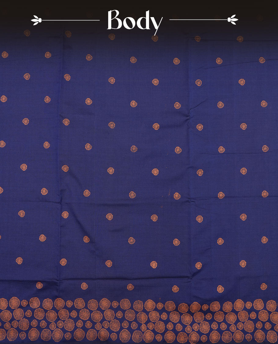 Navy blue colour poly cotton saree with orange abstract butti motifs on the body, paired with a matching pallu with dense orange textured round butta pattern, and a coordinated all‑over textured round butta printed blouse piece.