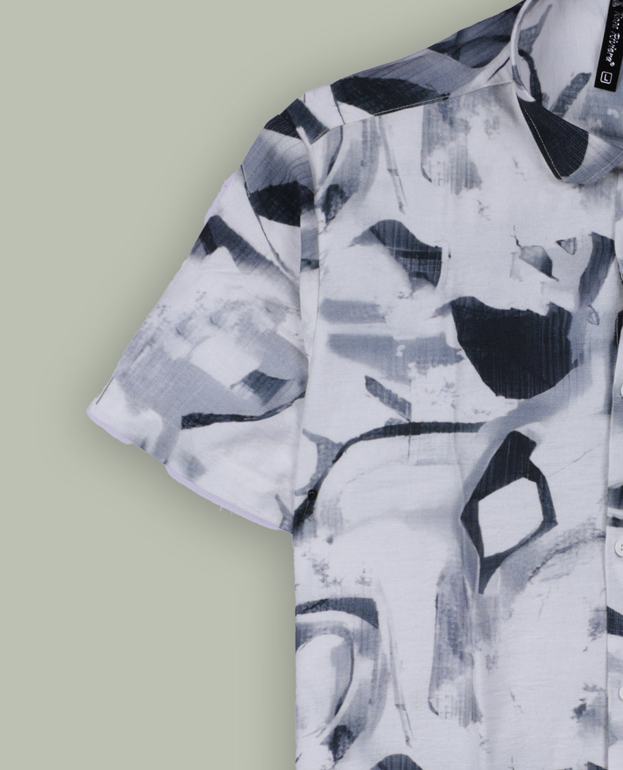 White colour shirt featuring bold green abstract brushstroke patterns, Styled with a classic collar and short sleeves, it brings a modern, artistic edge to your casual wardrobe.