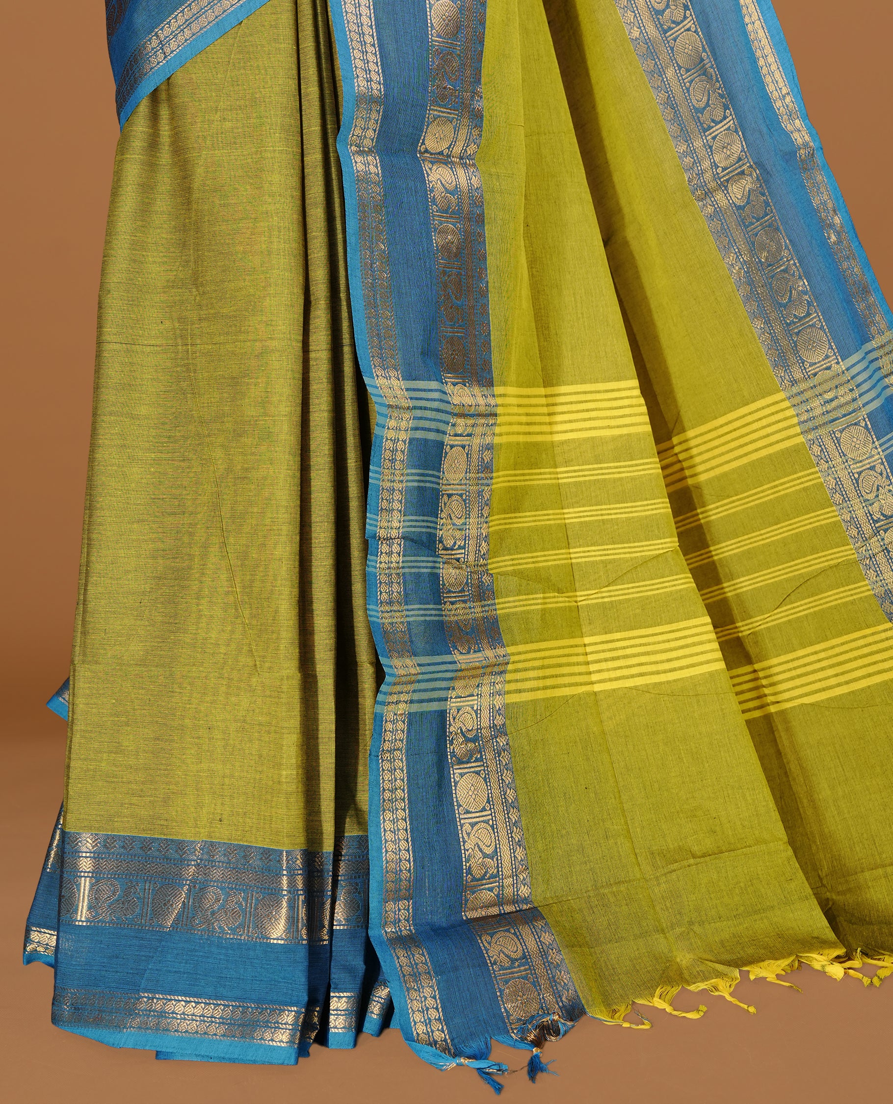 Lemon Green colour Chettinad cotton saree featuring Elegant plain body, complemented by contrast Blue colour with gold zari border, paired with matching blouse piece.