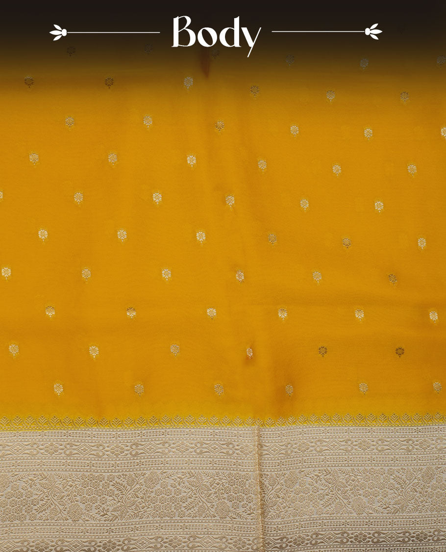 Yellow colour banaras satin crepe saree featuring gold zari motifs on body, with contrast cream colour border with gold zari pattern and paired with matching blouse.