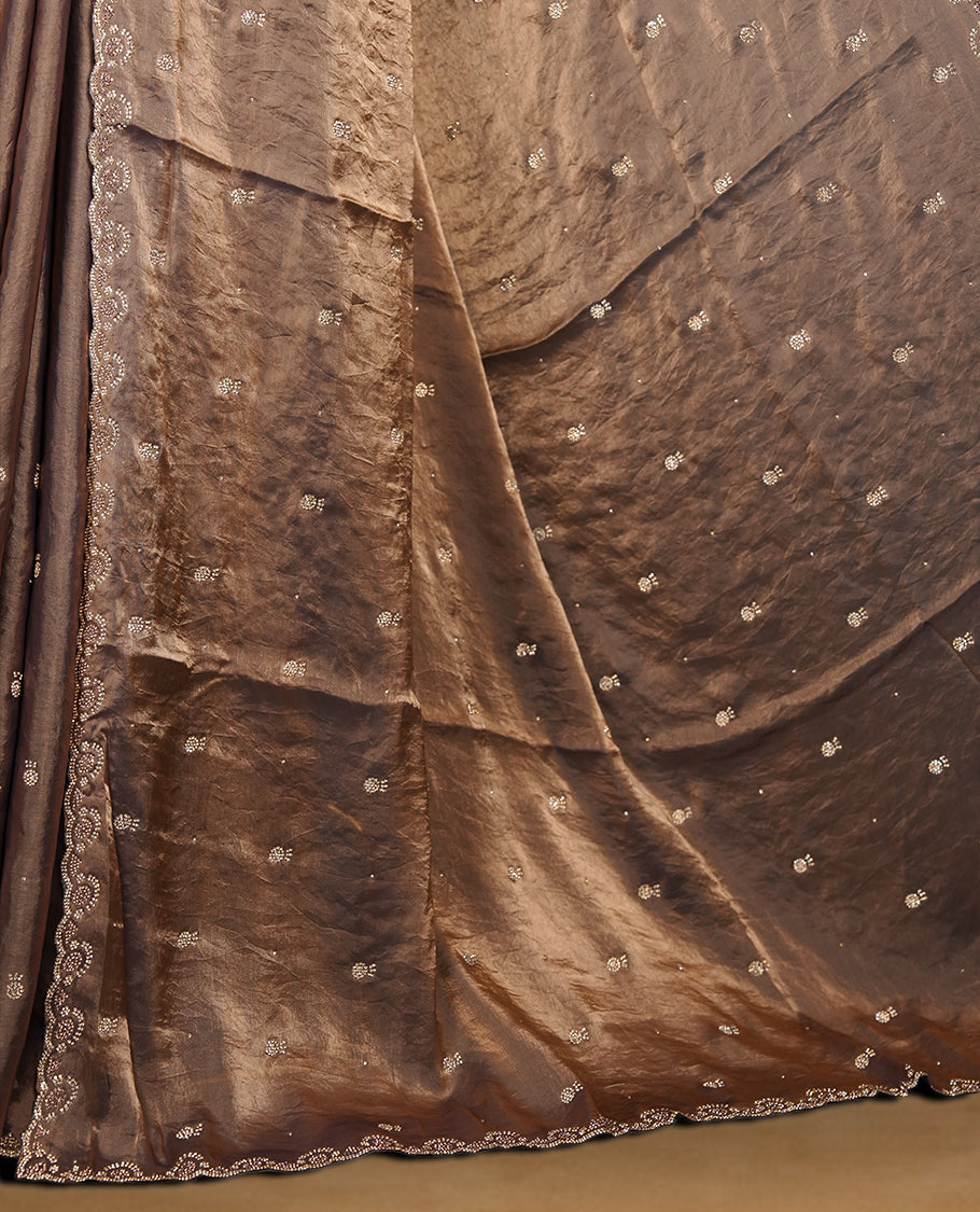 Antique Gold Colour Chiffon Designer Saree featuring Delicate White Stone Work All Over the Body, with Stone Detailing on the Border and Pallu, paired with a Matching Blouse.