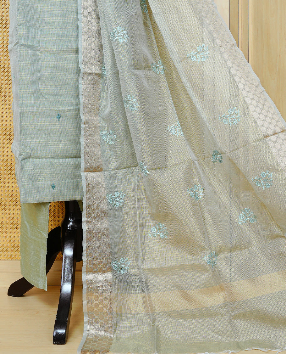 Goldish Pastel Green colour Tissue Churidar set featuring delicate floral embroidery on the round neckline, paired with matching solid pants and dupatta