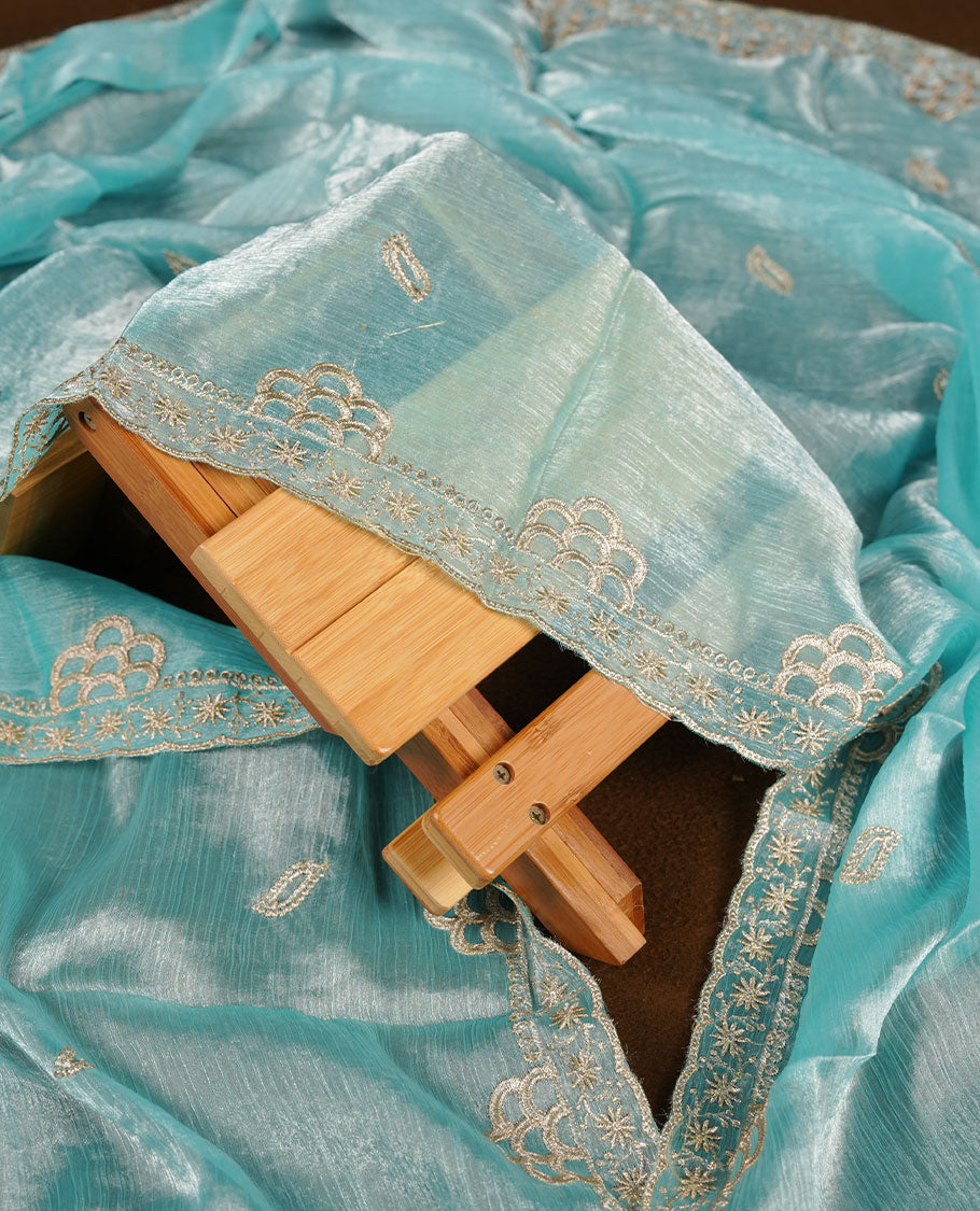 Sky blue colour churidar set with stone and thread embroidery and detailing, paired with matching pant and dupatta.