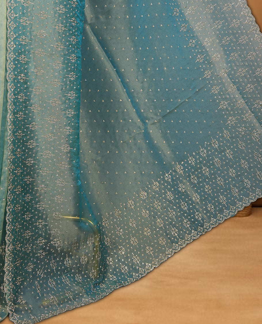Light blue Colour Shimmer Designer Saree featuring Delicate White Stone Scattered Work on the Body, enhanced with Intricate Stone Detailing on the Border and Pallu, paired with a Matching Blouse.