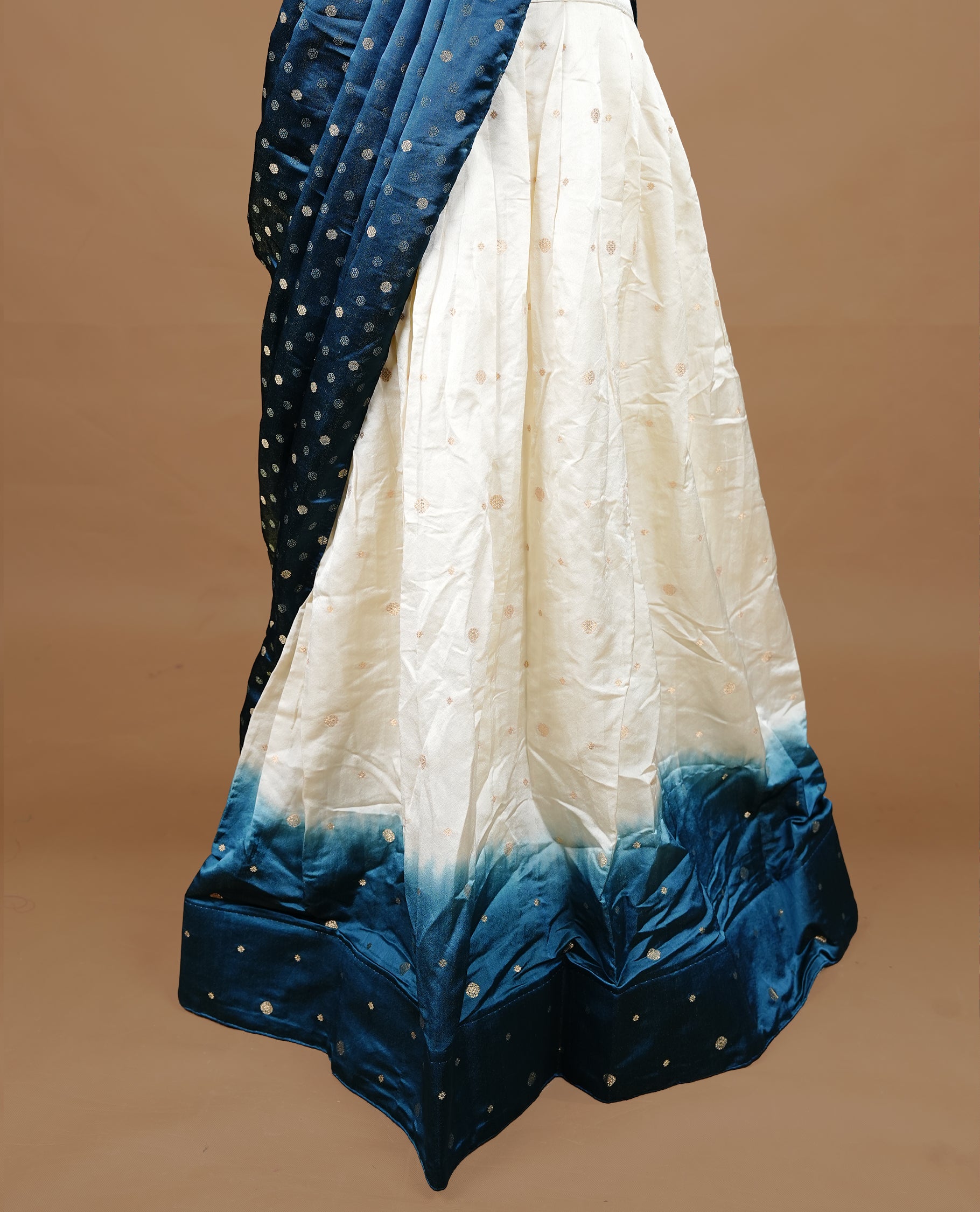 Off White colour half saree material featuring delicate zari buttas on the blouse and skirt, paired with a contrast Teal zari border and matching zari motifs dupatta