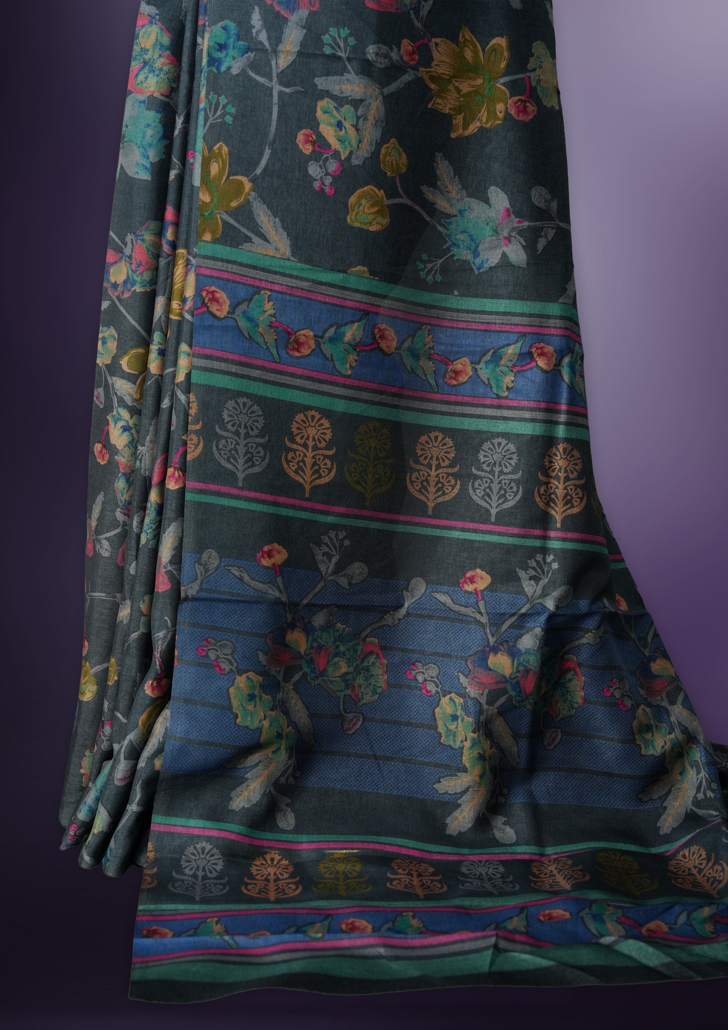 Grey colour saree enhanced with a vibrant multiple colour floral prints on body & pallu, and comes with a matching blouse.
