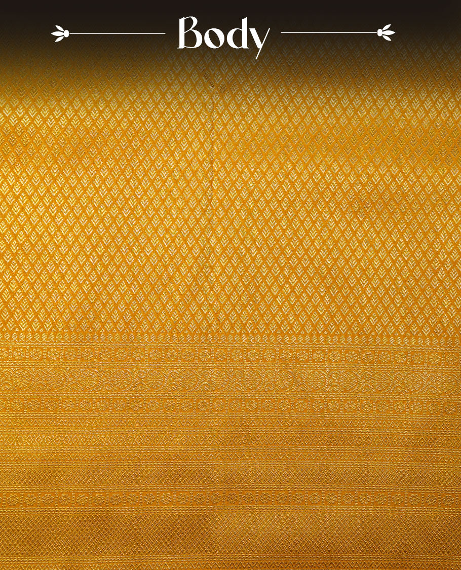 Golden mustard colour semi soft silk brocade saree featuring elegant self-woven motifs across the body, enhanced with a neatly detailed woven border and pallu, paired with a matching blouse.