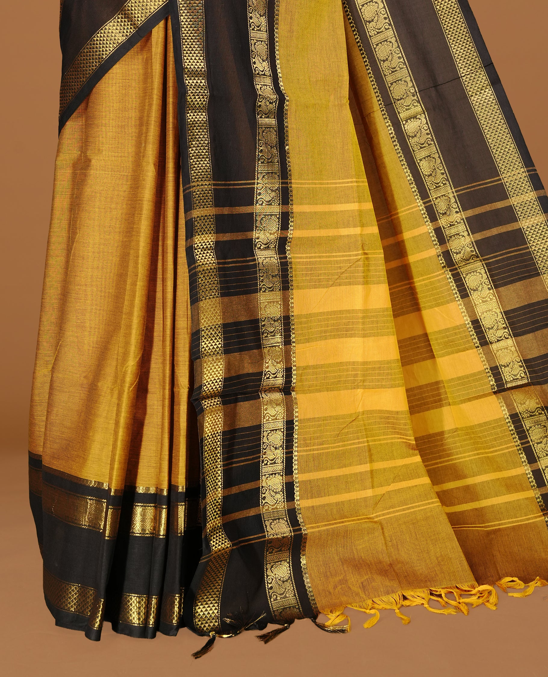 Mustard Colour Chettinad cotton saree featuring elegant plain body , complemented by contrast Black colour with traditional border, comes with matching blouse piece.