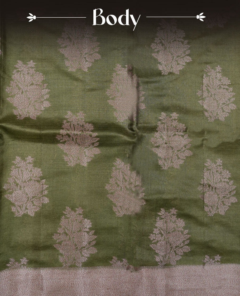 Olive green colour pure banaras tusser silk saree highlighting antique zari pattern across body, with contrast cream colour with zari border and paired with matching blouse