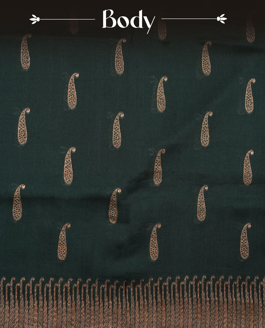 Dark green colour semi banaras tussar georgette featuring gold zari leaf pattern across body, finished with gold zari border and paired with matching blouse.