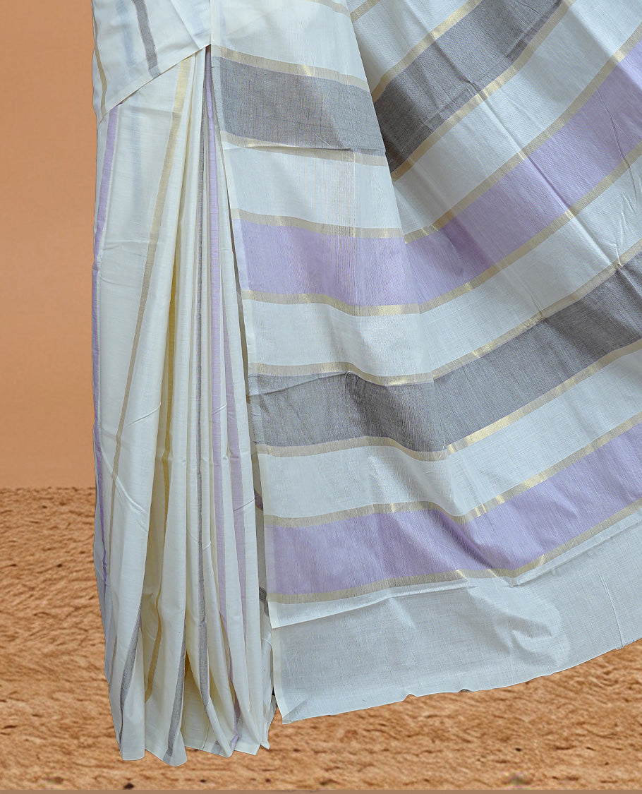 Off White Colour Cotton Kerala Saree Featuring Light Gold, Grey And Purple Zari Stripes On The Body, Enhanced By A Traditional Zari Border And Pallu, Paired With A Matching Blouse Piece.