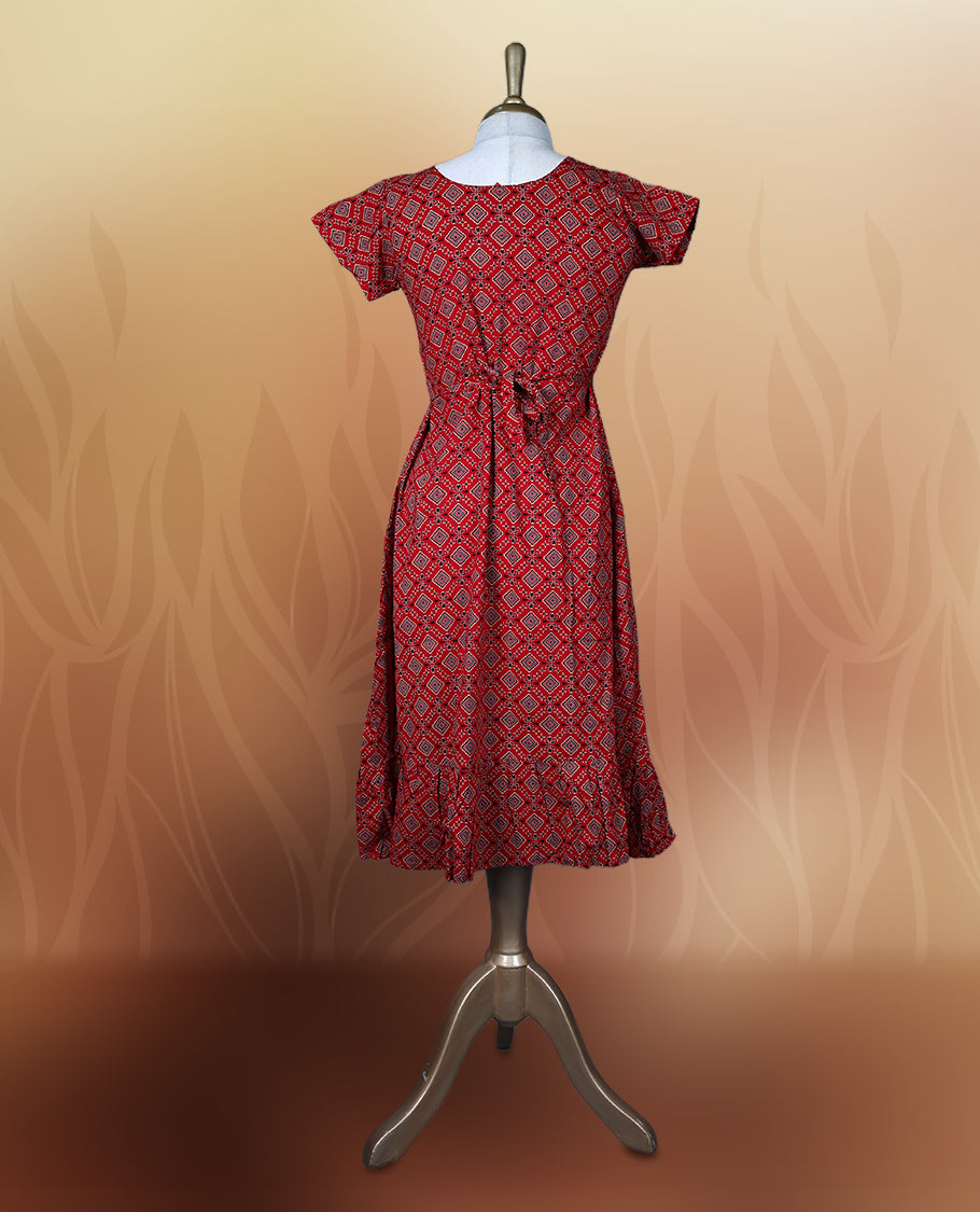 Red colour nightwear with a flattering V neck, short sleeves, and a geometric print & Features a fitted silhouette with a flared hem, Perfect for casual outings or festive occasions.