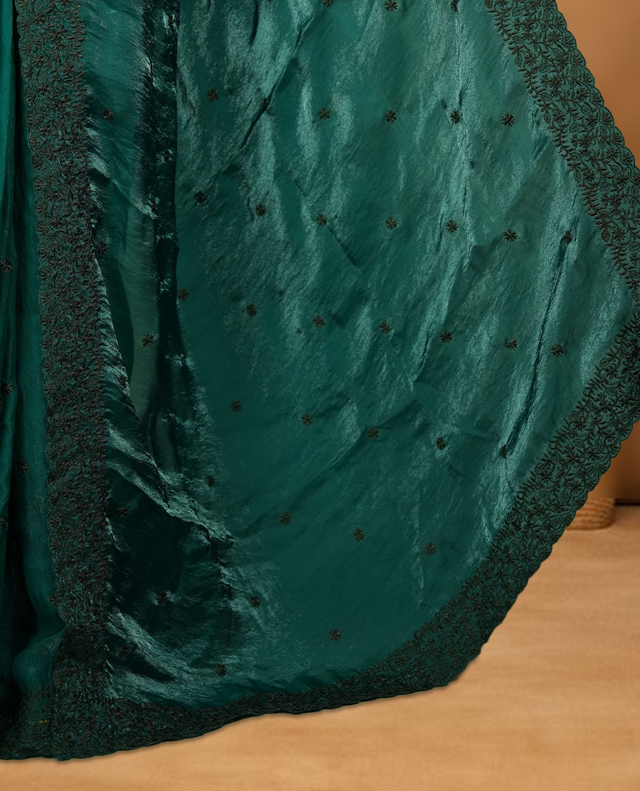 Dark green colour velvet chiffon saree featuring black colour thread embroidery pattern on body, border and paired with matching blouse piece.
