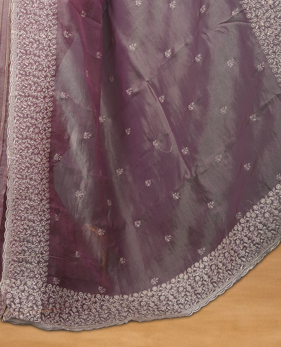 Pastel Lavender colour net organza saree featuring white thread embroidery motifs on body and thread detailing on the border and paired matching blouse.