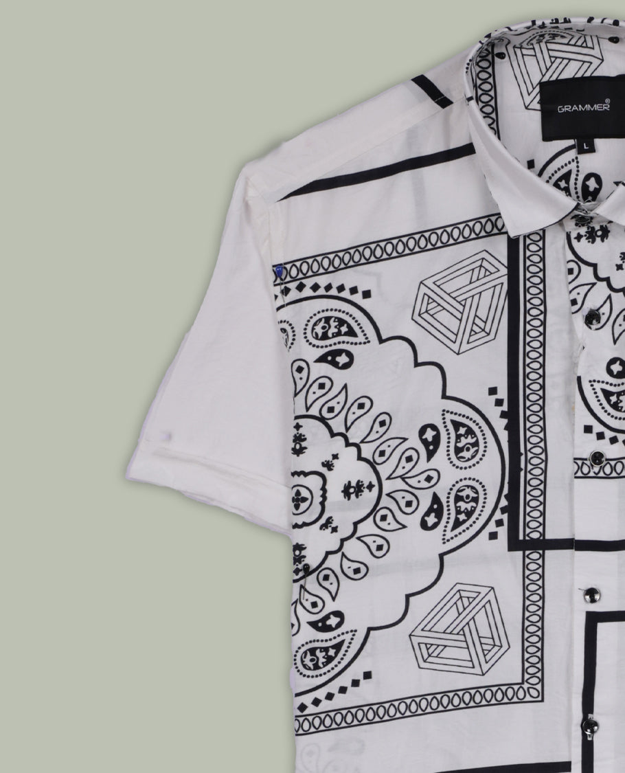 White colour shirt adorned with elegant black colour floral prints, Designed with a classic collar and short sleeves, this timeless piece offers a crisp and casual look, perfect for both work and weekend wear.
