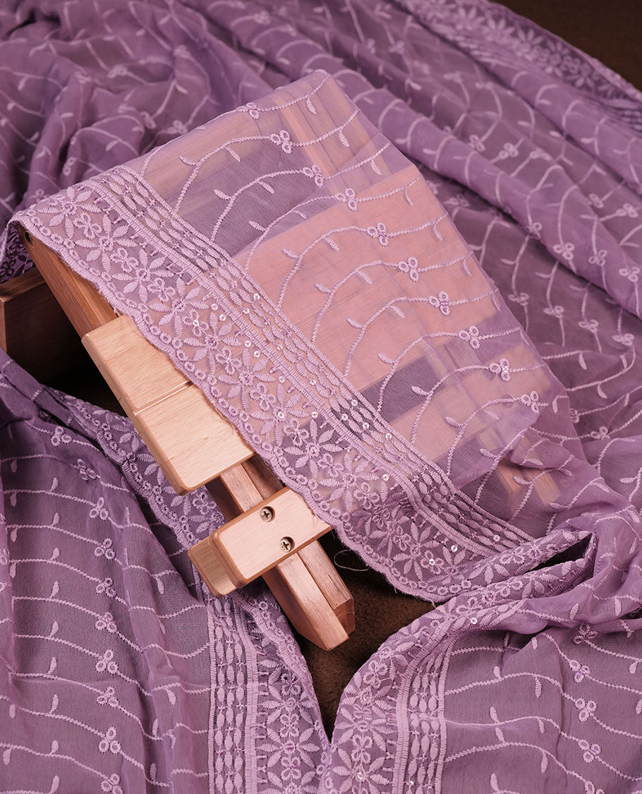 Lavender colour churidhar Material featuring Intricate Thread Embroidery with Mirror and Cut Beads Work on the Front Panel, paired with an All Over Embroidered Net Dupatta and Matching Bottom