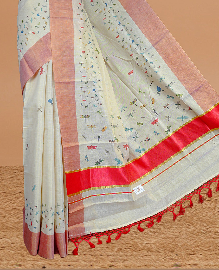 Cream Colour Kerala Saree Featuring Plain Body ,Complemented By A Red Zari With Dragonfly Printed Border ,Enhance By A Red With Gold Zari Pallu ,Paired With A Matching Blouse Piece.