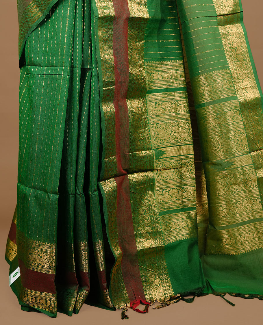 Green colour chettinad cotton saree featuring gold zari stripes on body, highlighting Mixed red colour with zari border, paired with matching blouse piece.