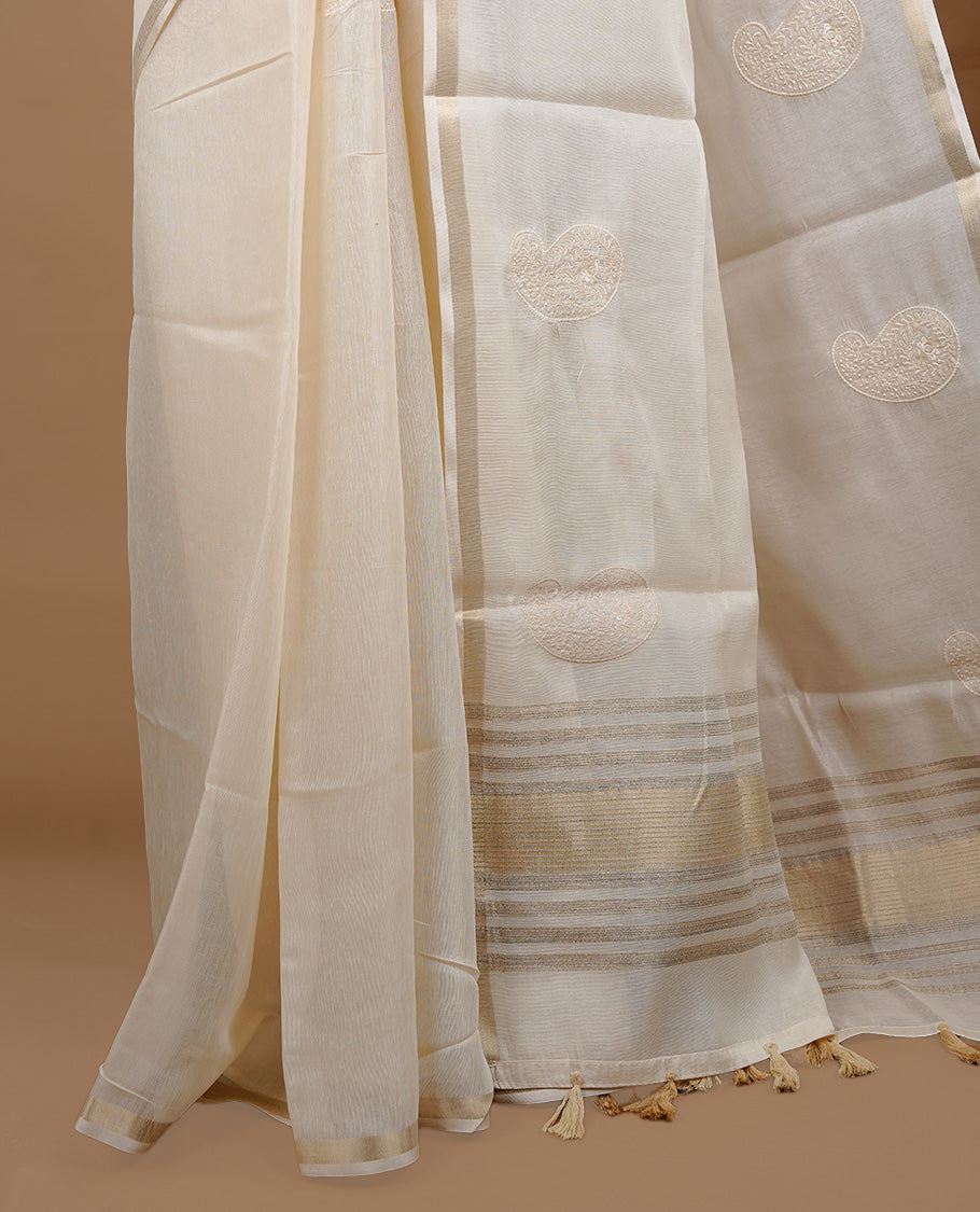 Cream colour Tussar saree featuring cream colour Mango pattern with chikankari embroidery work, highlighting gold zari simple border, paired with matching unstitched blouse.