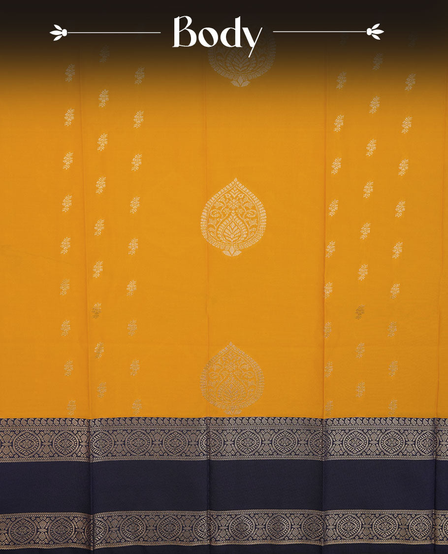 Mustard colour semi silk saree highlighting gold zari motifs across body, featuring contrast Dark blue colour border with gold zari pattern, comes with matching blouse .