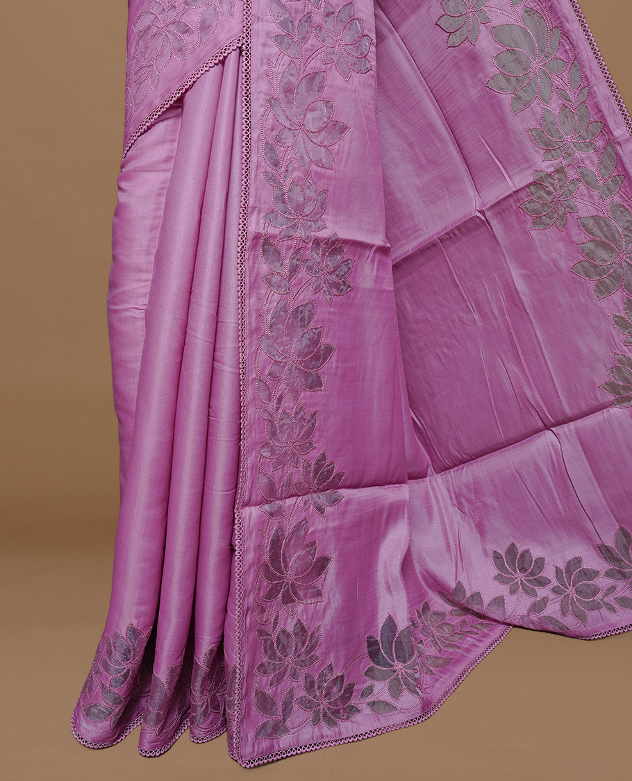 Pastel Pink colour Designer saree Featuring Elegant plain body, enhance with thread Lotus Pattern with lace border, paired with matching blouse piece.
