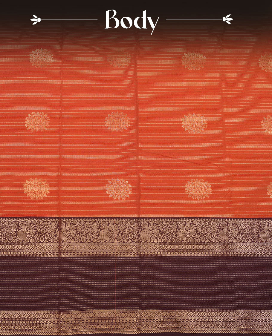 Dark Rust orange colour semi silk saree featuring gold zari stripes and floral motifs on body highlighting contrast dark chocolate gold zari peacock border , paired with matching blouse