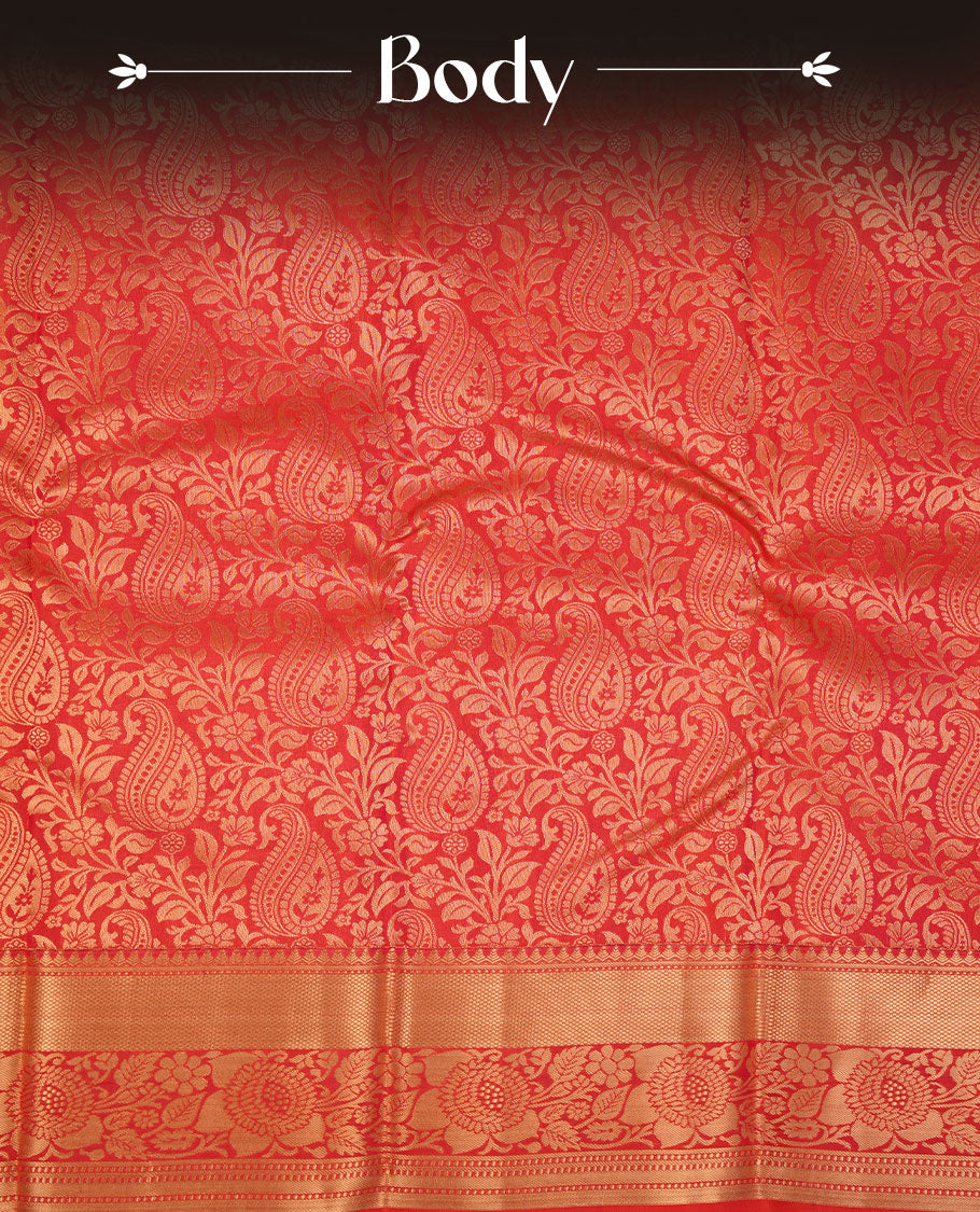 Peach orange colour kancheepuram silk saree featuring floral zari jacquard on body with traditional border, paired with matching blouse piece.